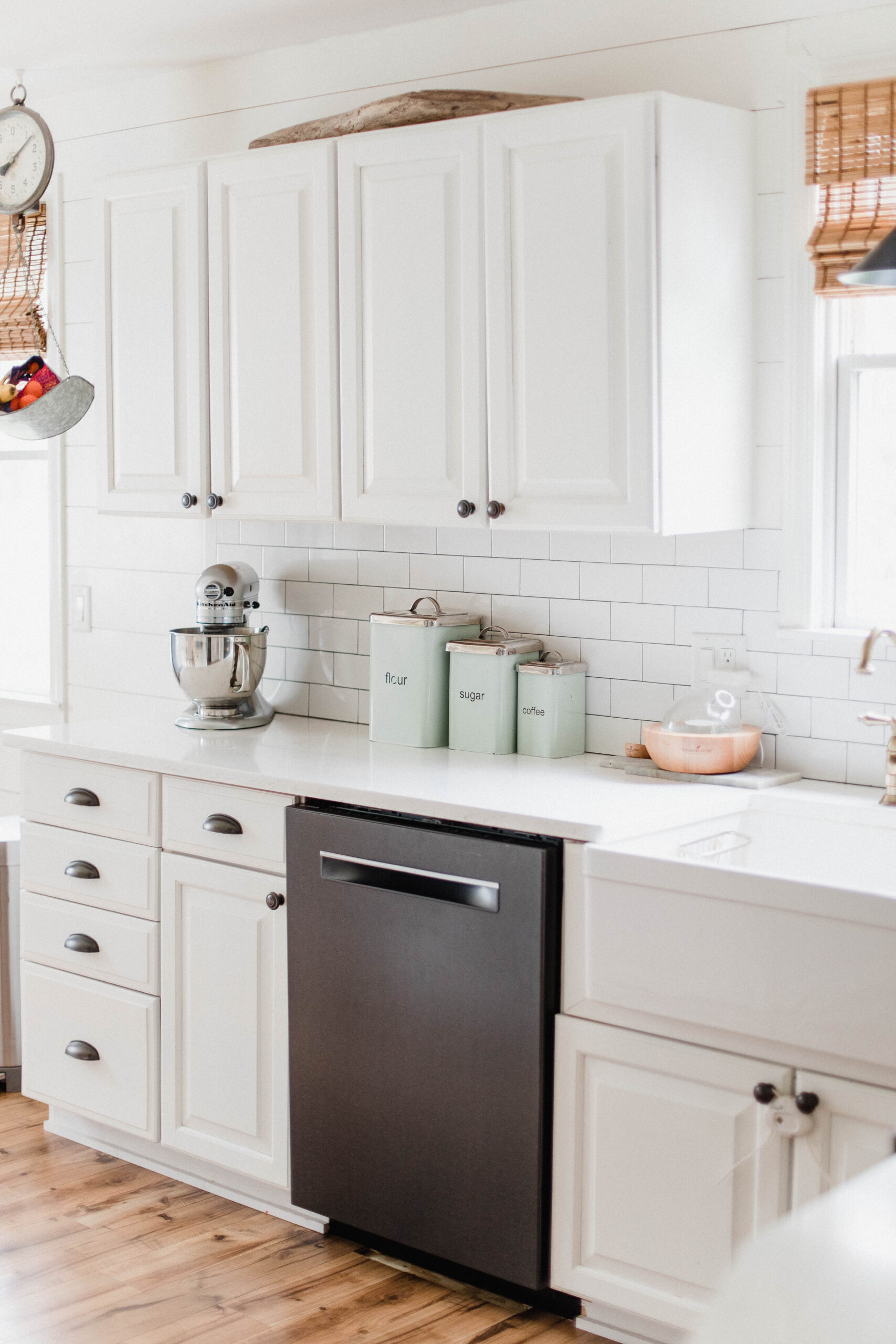 Connecticut life and style blogger Lauren McBride shares her farmhouse inspired kitchen in her coastal farmhouse home, including source list.