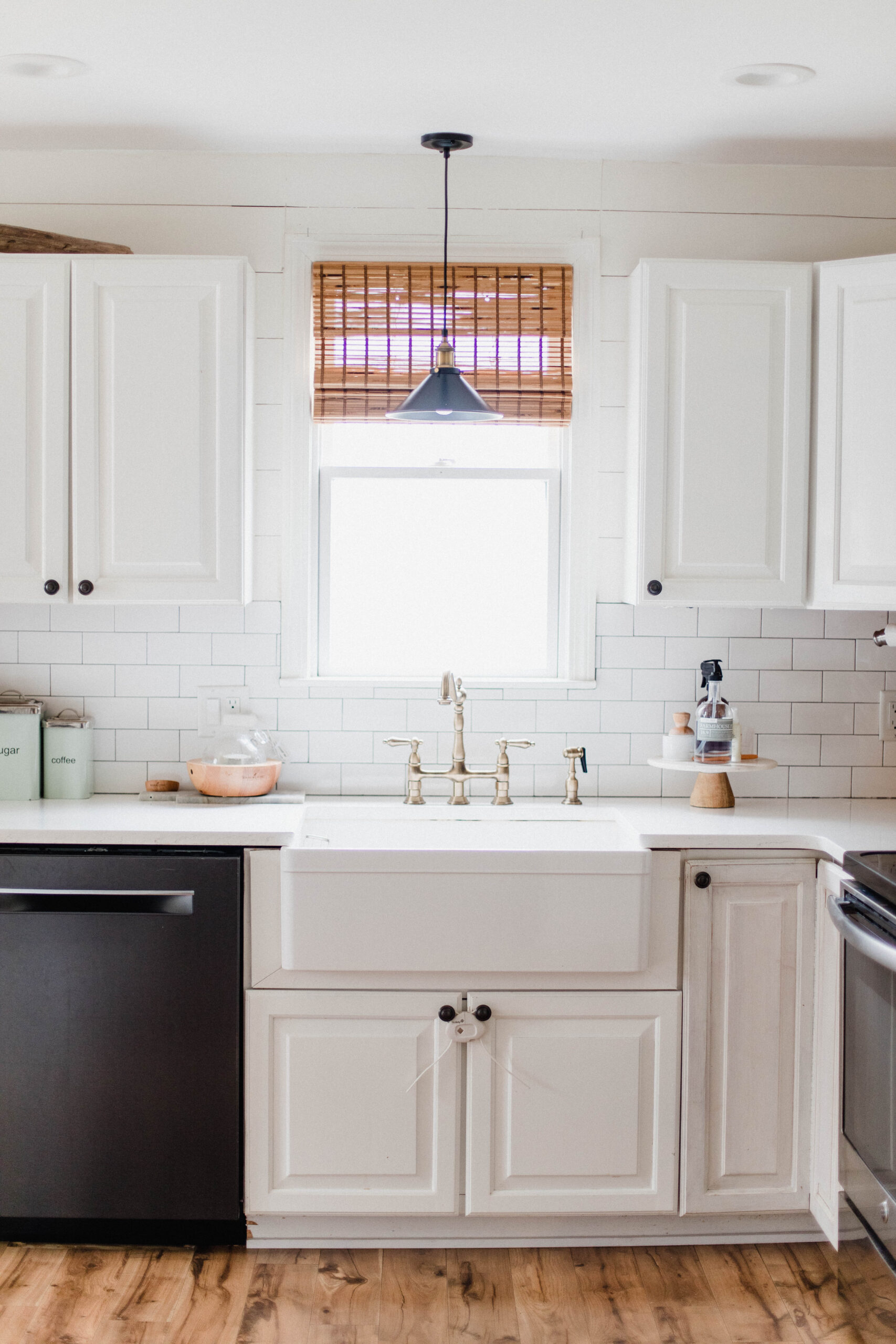 Connecticut life and style blogger Lauren McBride shares her farmhouse inspired kitchen in her coastal farmhouse home, including source list.