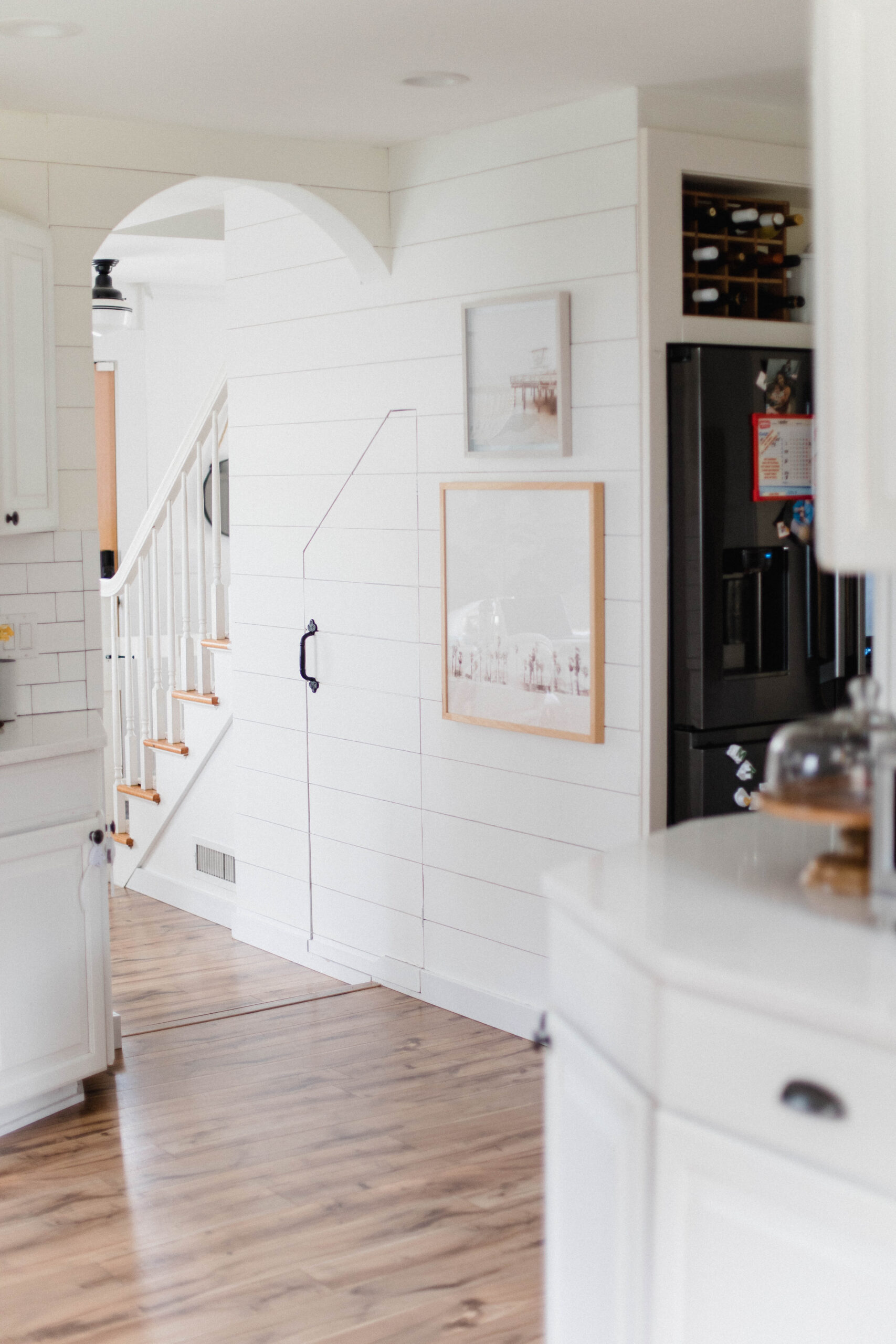 Connecticut life and style blogger Lauren McBride shares her farmhouse inspired kitchen in her coastal farmhouse home, including source list.