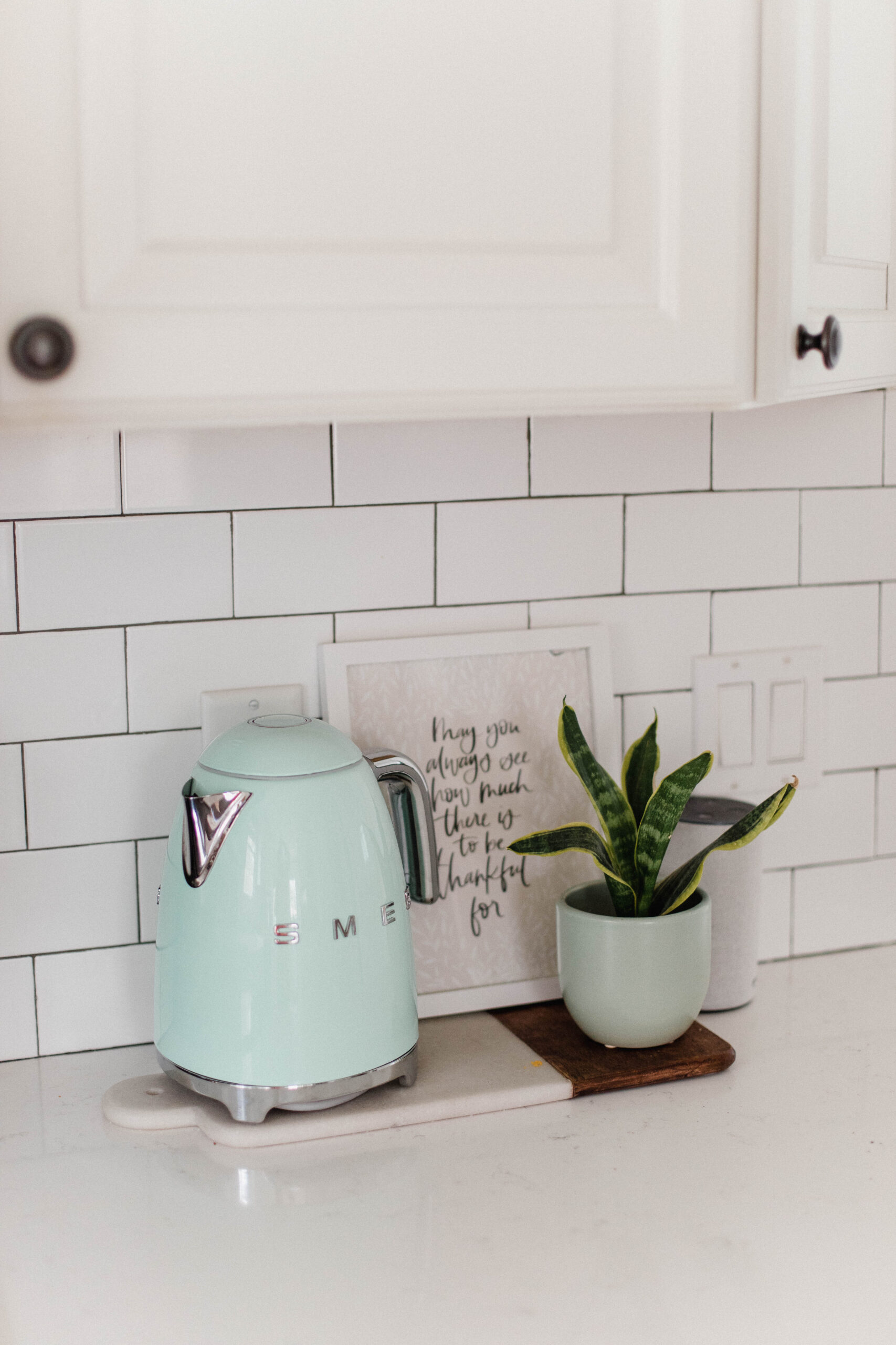 Connecticut life and style blogger Lauren McBride shares her farmhouse inspired kitchen in her coastal farmhouse home, including source list.