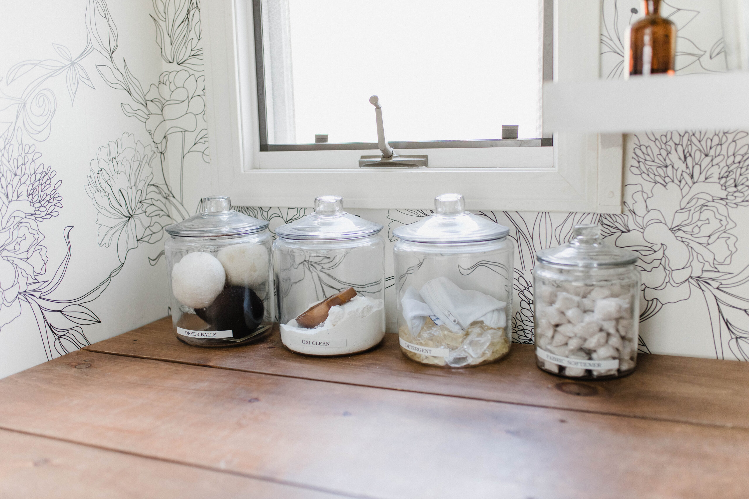 Laundry Room Makeover. Glass jar to hold laundry detergent. - The Modest Mom