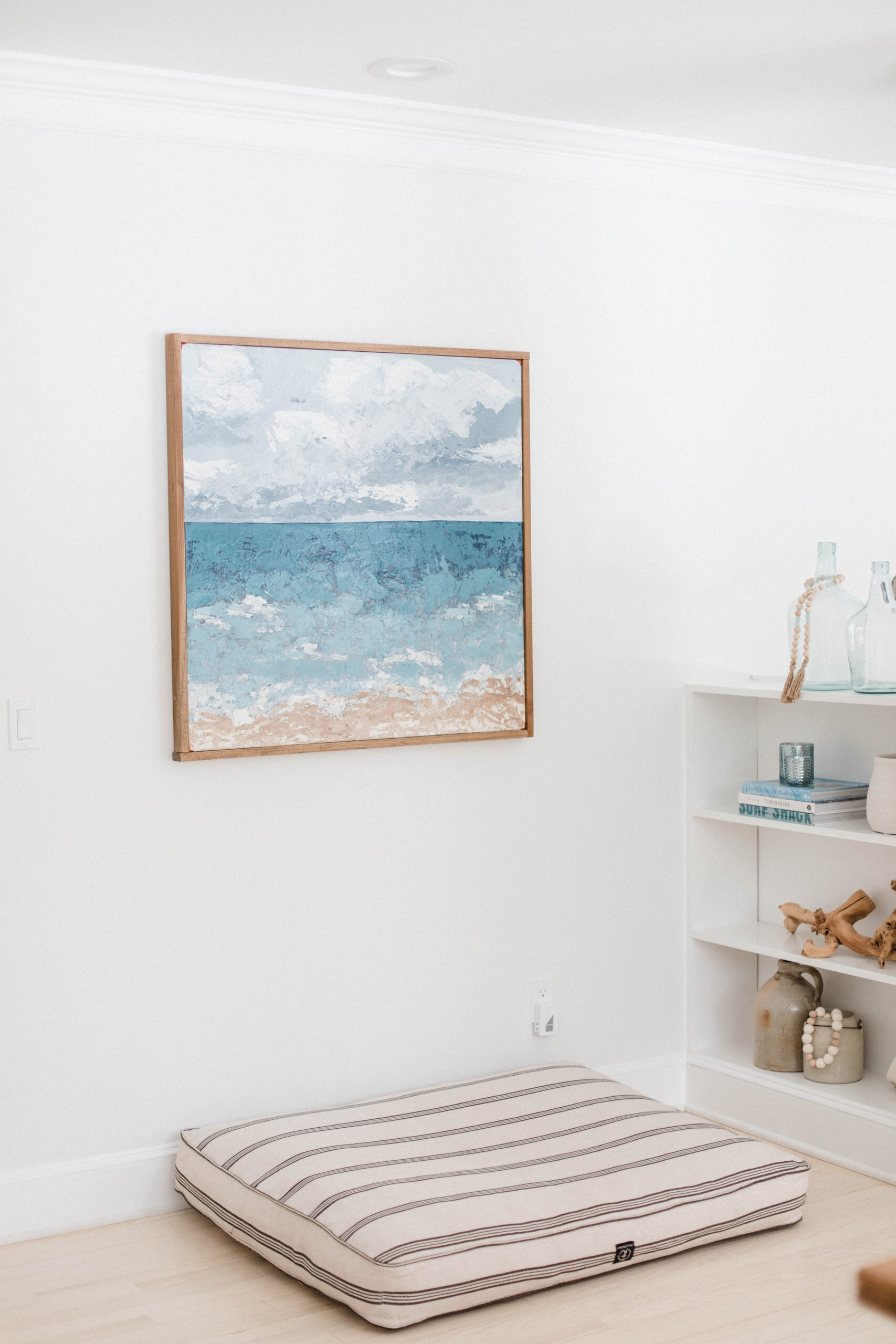 Connecticut life and style blogger Lauren McBride shares the coastal artwork in her modern coastal inspired home.