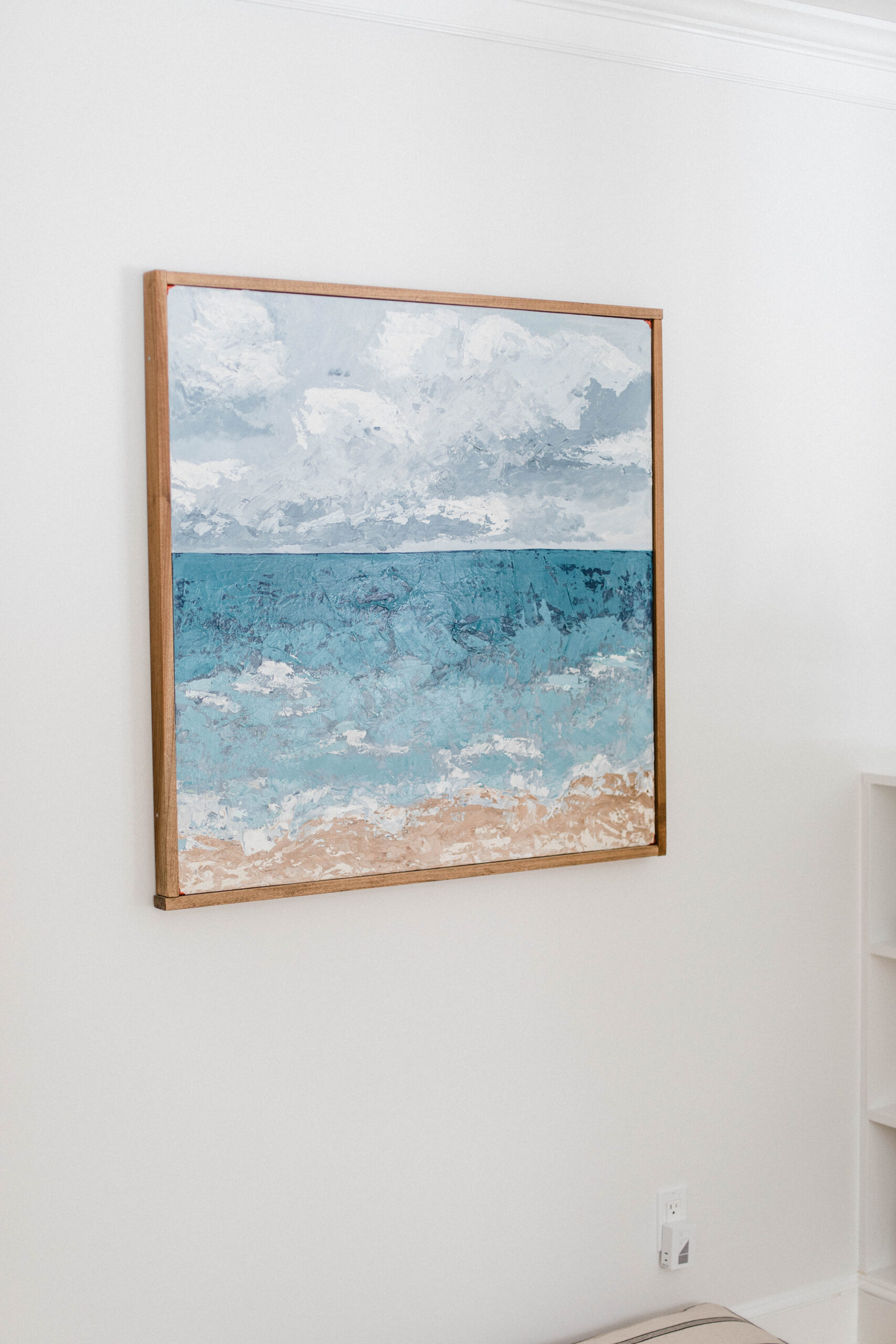 Connecticut life and style blogger Lauren McBride shares the coastal artwork in her modern coastal inspired home.