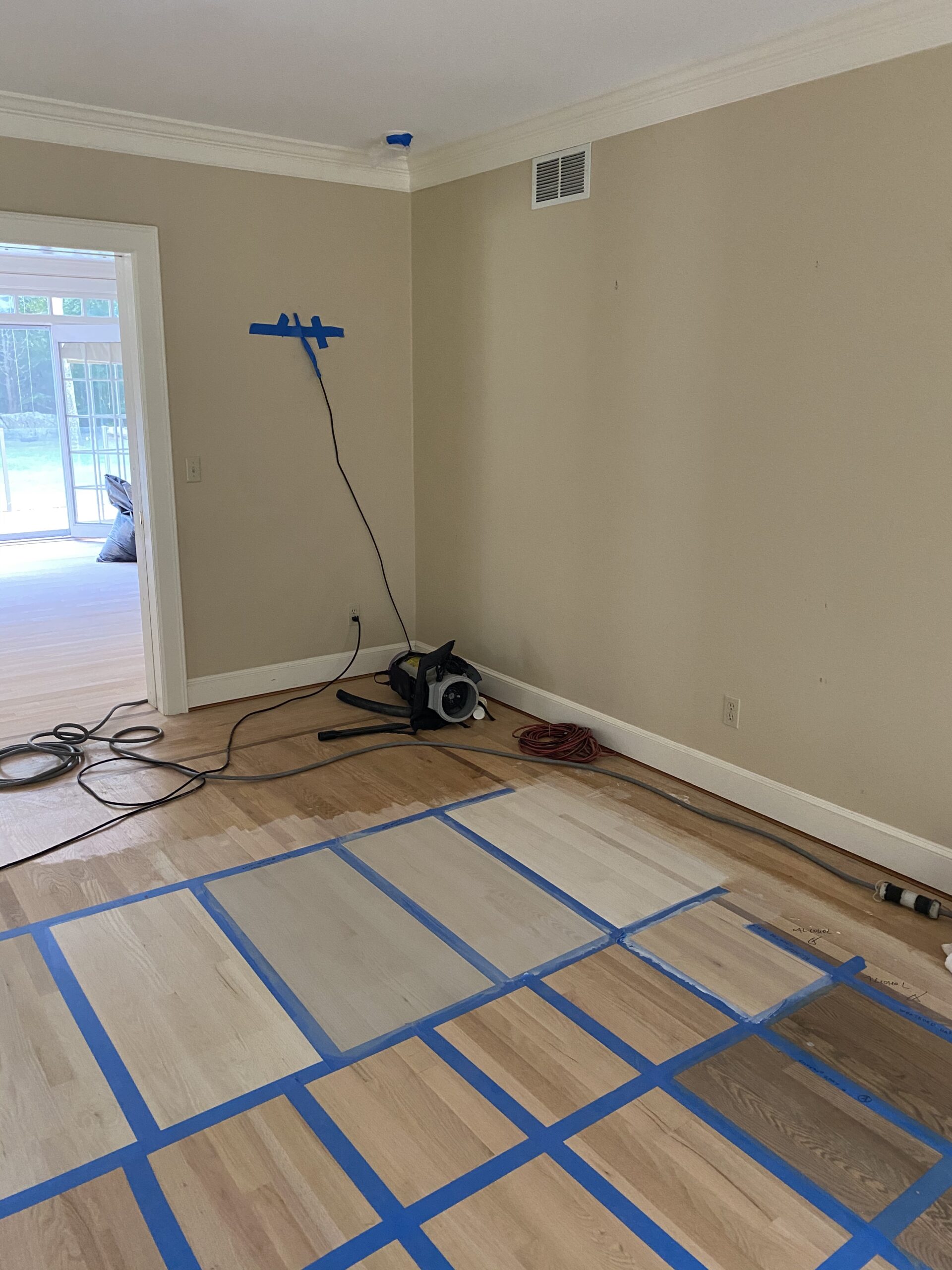 Connecticut life and style blogger Lauren McBride shares the process for bleaching and staining light, coastal-inspired wood flooring. 