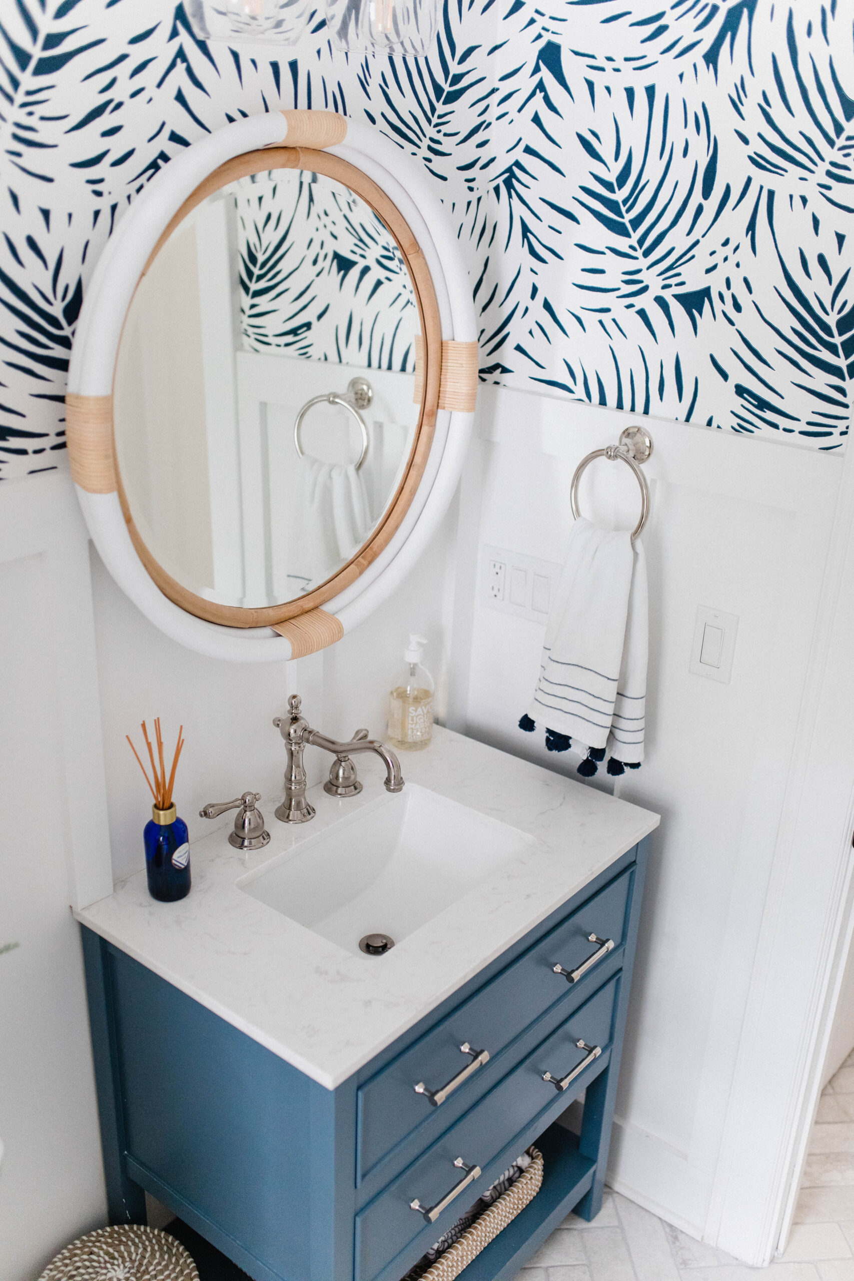 Connecticut life and style blogger Lauren McBride shares her modern coastal mudroom and bathroom makeover including sources.