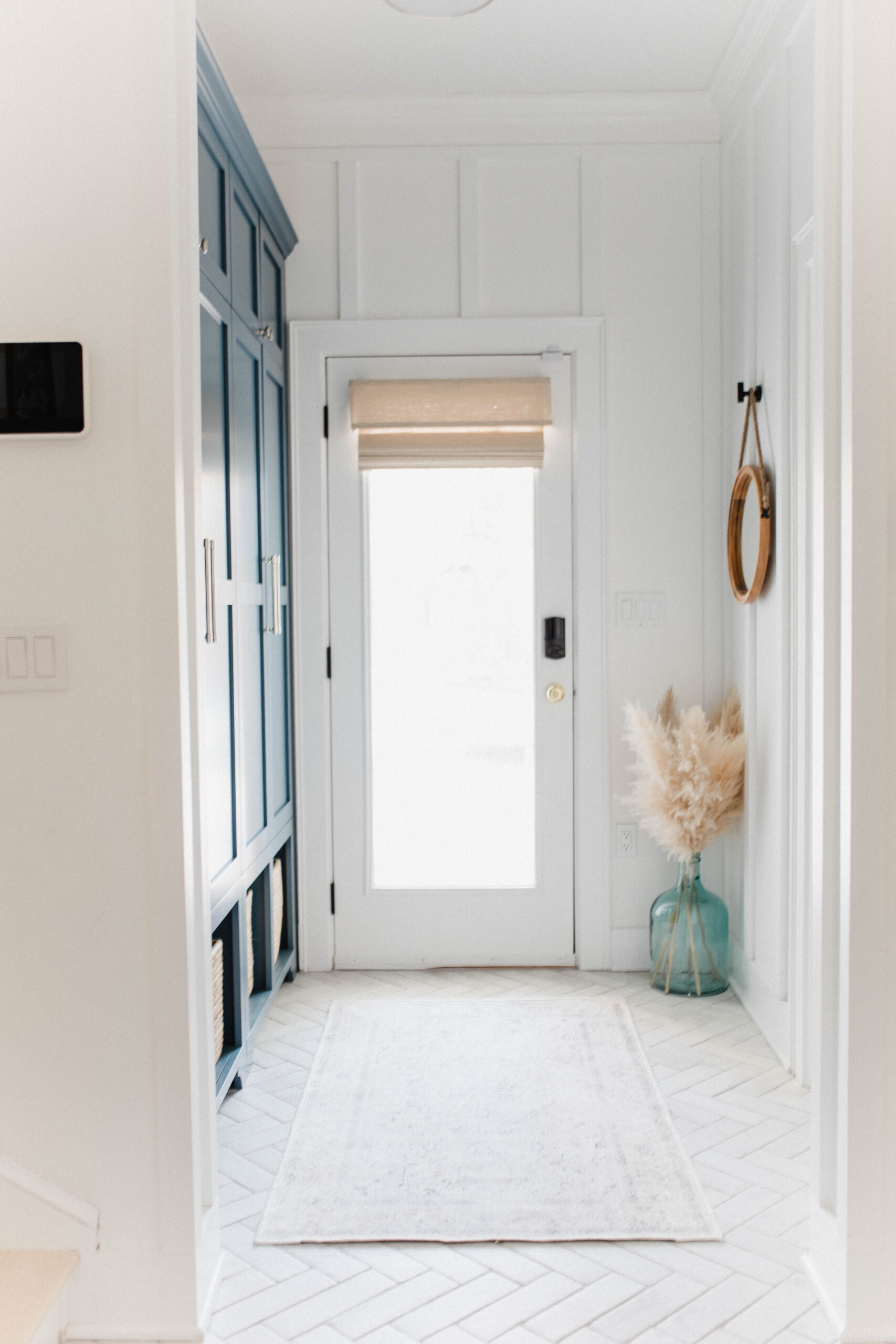 Connecticut life and style blogger Lauren McBride shares her modern coastal mudroom and bathroom makeover including sources.