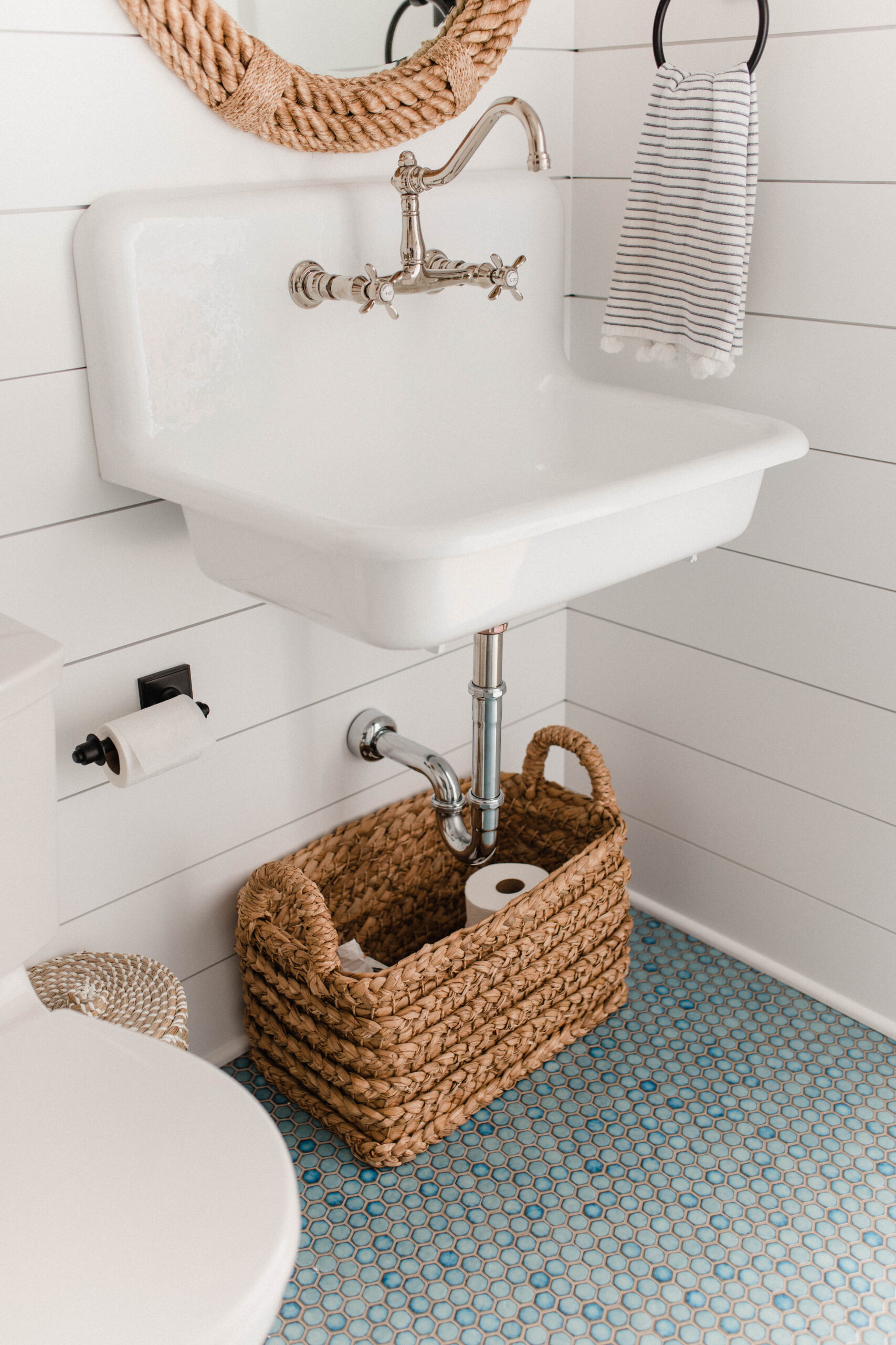 Connecticut life and style blogger Lauren McBride shares her modern coastal laundry room decor from Serena and Lily.