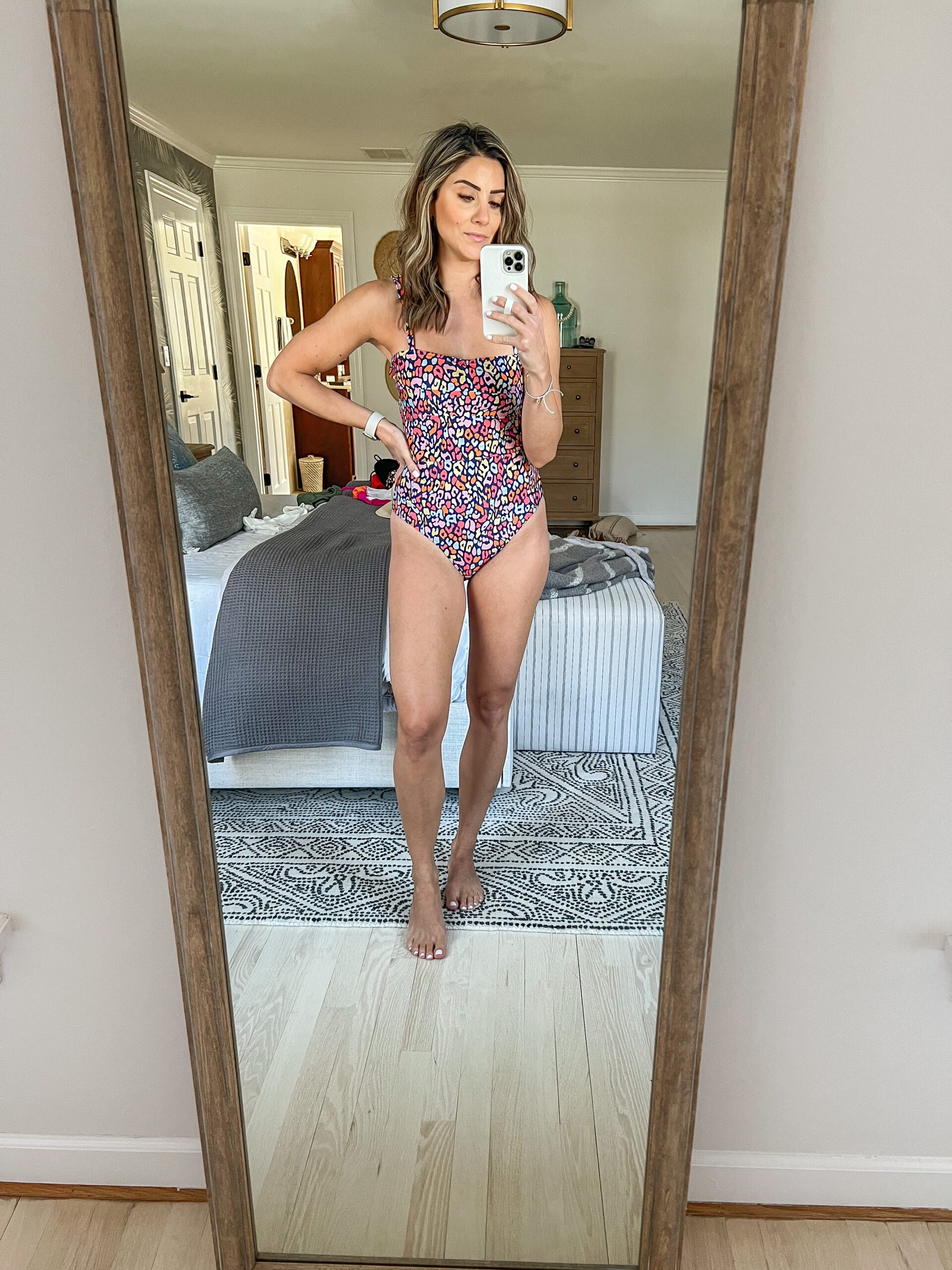 Connecticut life and style blogger Lauren McBride shares stylish one-piece swimsuits with moderate to full coverage.