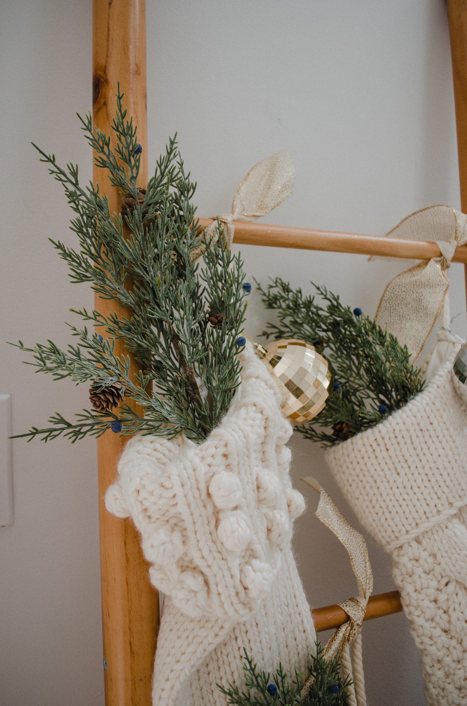 Connecticut life and style blogger Lauren McBride shares how to hang stockings without a mantle for the holidays.